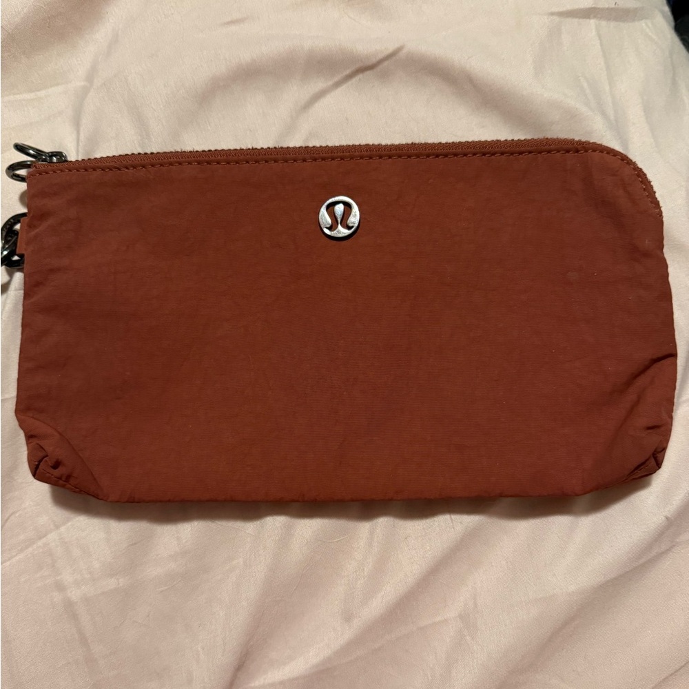 Lululemon Athletica orange/rust wristlet